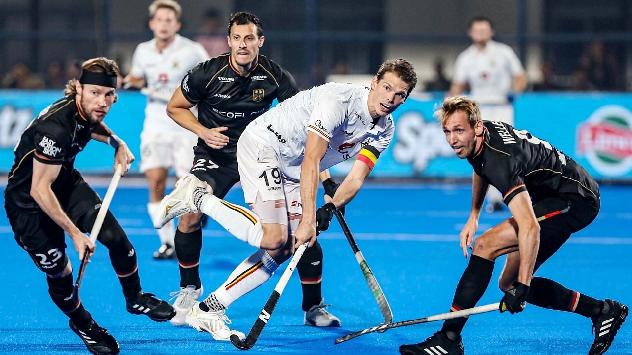 Players in action during the 2023 Men's FIH Hockey World Cup final match between Germany and Belgium. Credit: IANS Photo