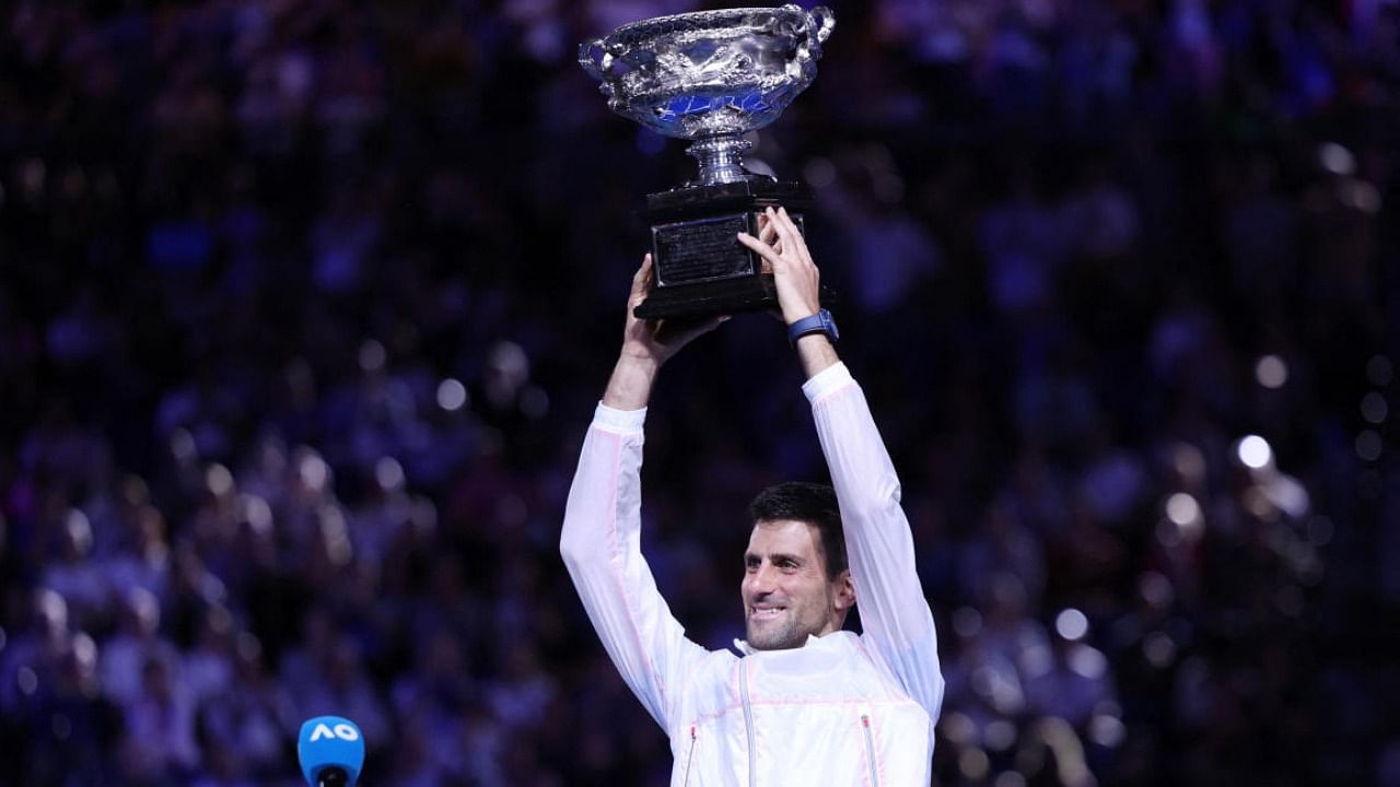Serbia's Novak Djokovic celebrates with the trophy after winning his final match against Greece's Stefanos Tsitsipas. Credit: Reuters 