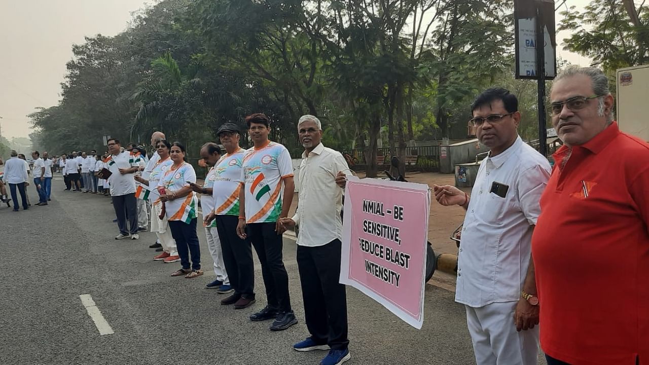 The silent protesters held a series of banners conveying the message that NMIA Limited must reduce the intensity of blasts. Credit: Special Arrangement