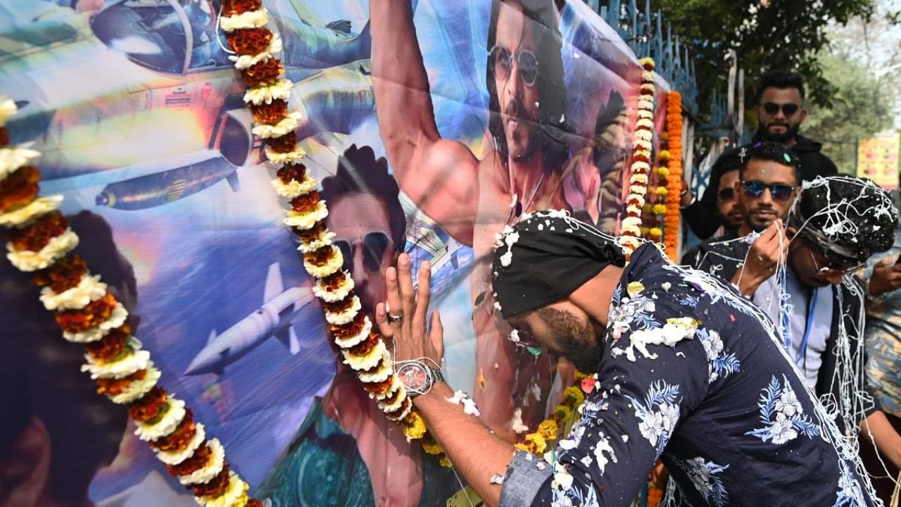 Fans of Bollywood of actor Shah Rukh Khan celebrate the release of his movie 'Pathaan', outside a movie theatre in Kolkata, Wednesday, Jan. 25, 2023. Credit: PTI Photo