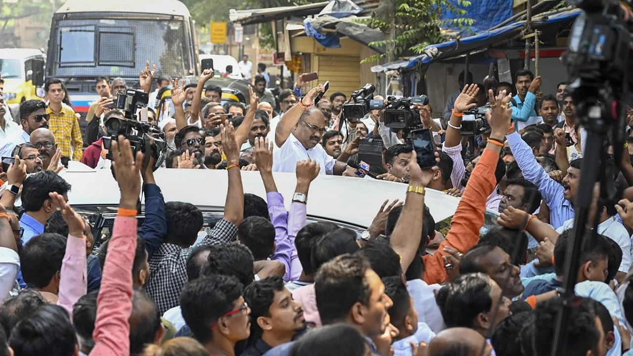 Shiv Sena (Uddhav Balasaheb Thackeray) leader Anil Parab with party supporters raises slogans during a protest outside the Maharashtra Housing and Area Development Authority (MHADA) office at Bandra. Credit: PTI Photo