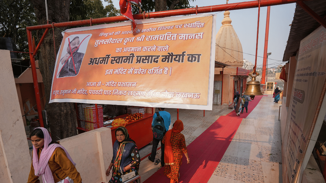 A banner is put up to prohibit entry of Samajwadi party leader Swami Prasad Maurya at 'Lete Haunman Temple', in Lucknow. Credit: PTI Photo