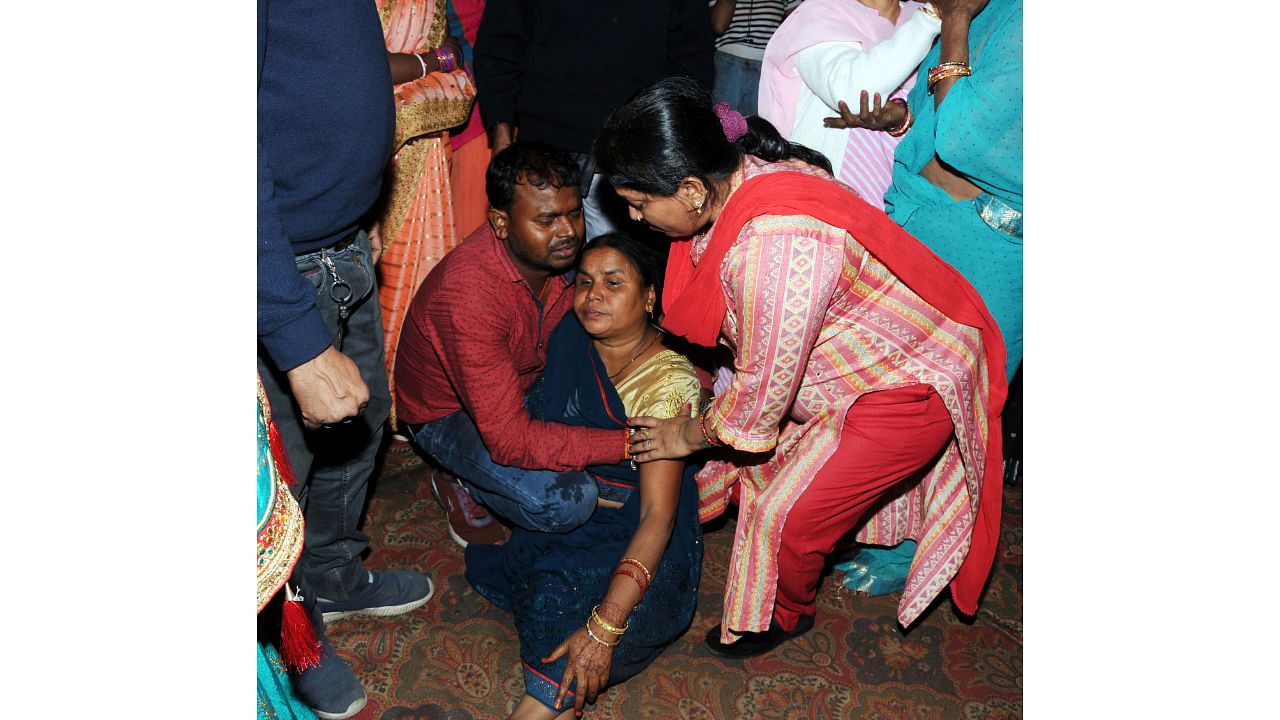 Family members of the victims mourn after a major fire broke out in a multi-storey building in Dhanbad. Credit: PTI Photo