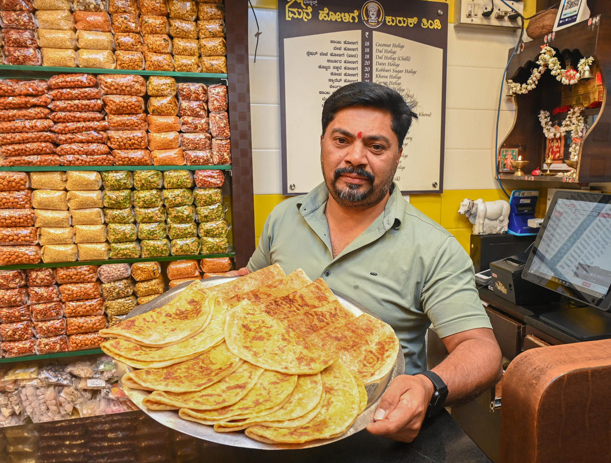 Bhaskar K R at the DVG Road branch of his food and condiment business, Bhaskar’s Mane Holige. DH Photo by S K Dinesh