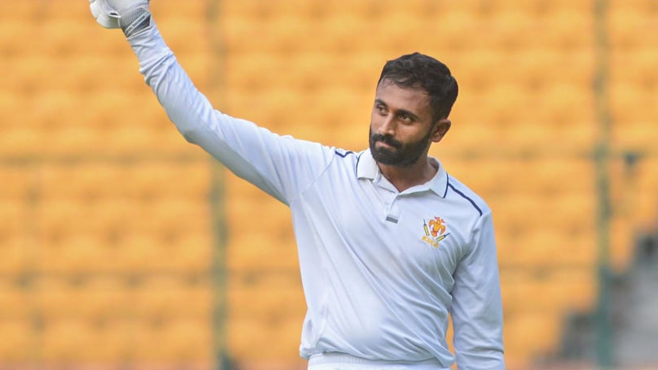 Karnataka's Shreyas Gopal raises his bat after scoring century during the second day of the 2nd quarter final of Ranji Trophy match between Karnataka and Uttarakhand. Credit: PTI Photo