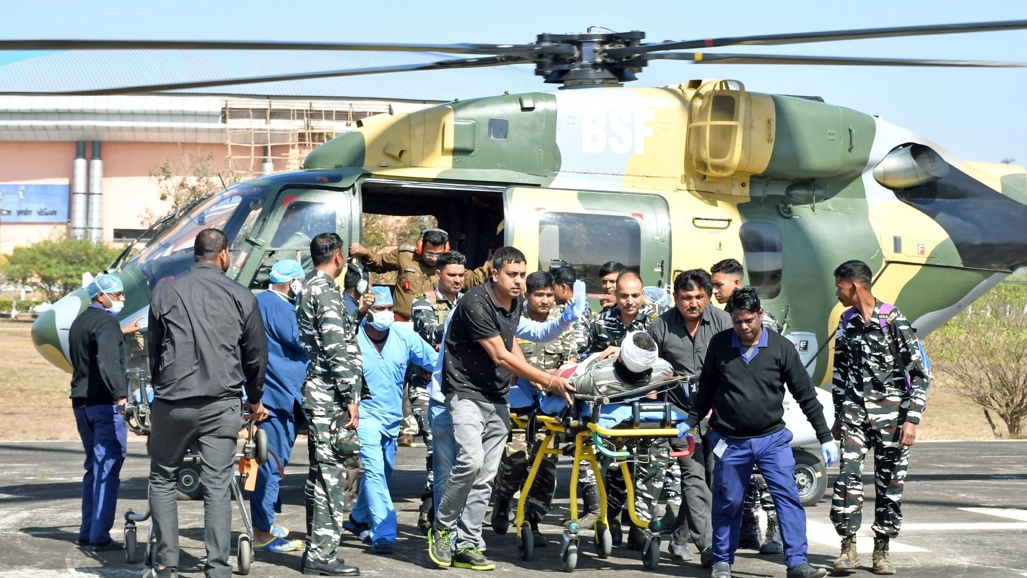 An injured paramilitary jawan of CRPF is being taken to hospital for further treatment after an IED blast. Credit: IANS Photo