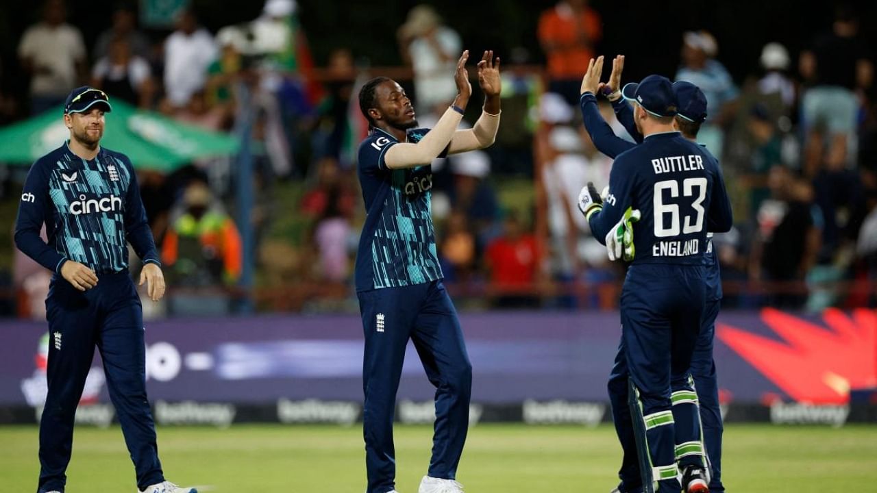 England's Jofra Archer (C) celebrates with teammates after the dismissal of South Africa's Tabraiz Shamsi during the third one day international (ODI) cricket match between South Africa and England. Credit: AFP Photo