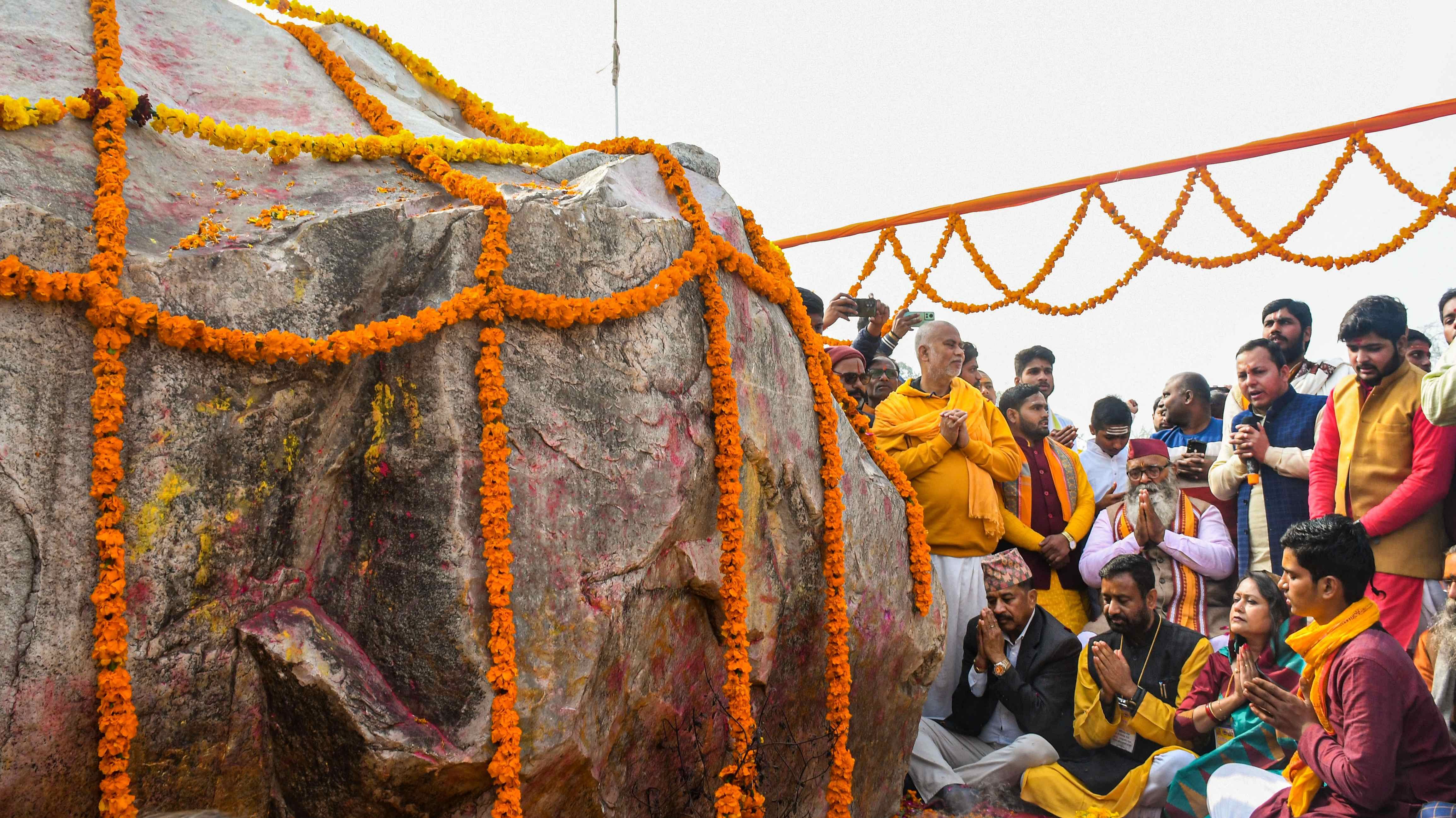 Priests and local people offer prayers near the holy stone Shaligram after its arrival from Nepal, at Karsewak Puram in Ayodhya. Credit: PTI Photo