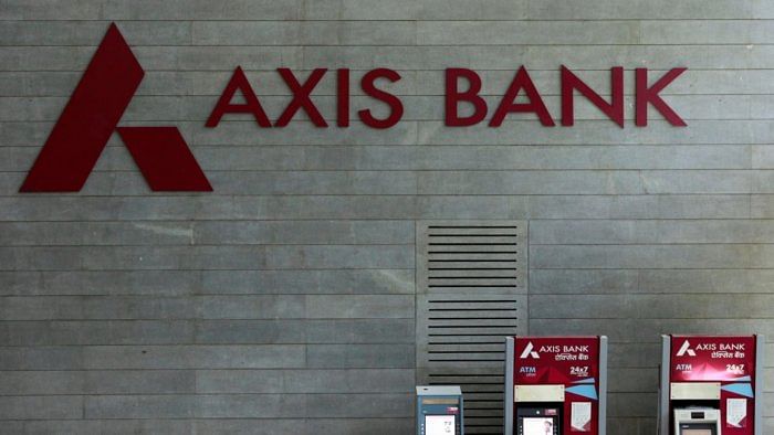 Axis Bank's logo is seen next to ATM machines at its corporate headquarters in Mumbai. Credit: Reuters Photo
