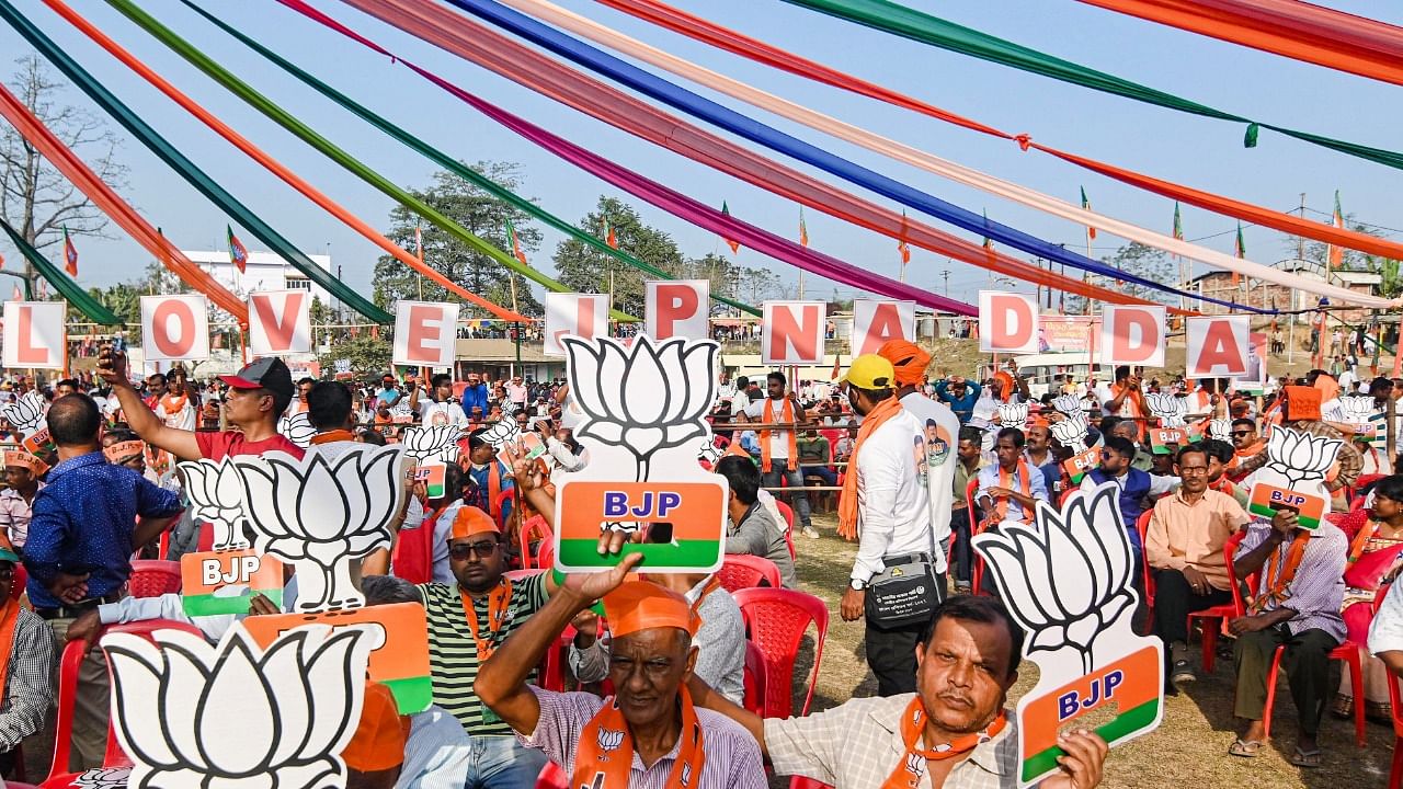  BJP supporters attend the party's 'Vijay Sankalpa Janasabha' rally ahead of Tripura Legislative Assembly elections. Credit: PTI Photo