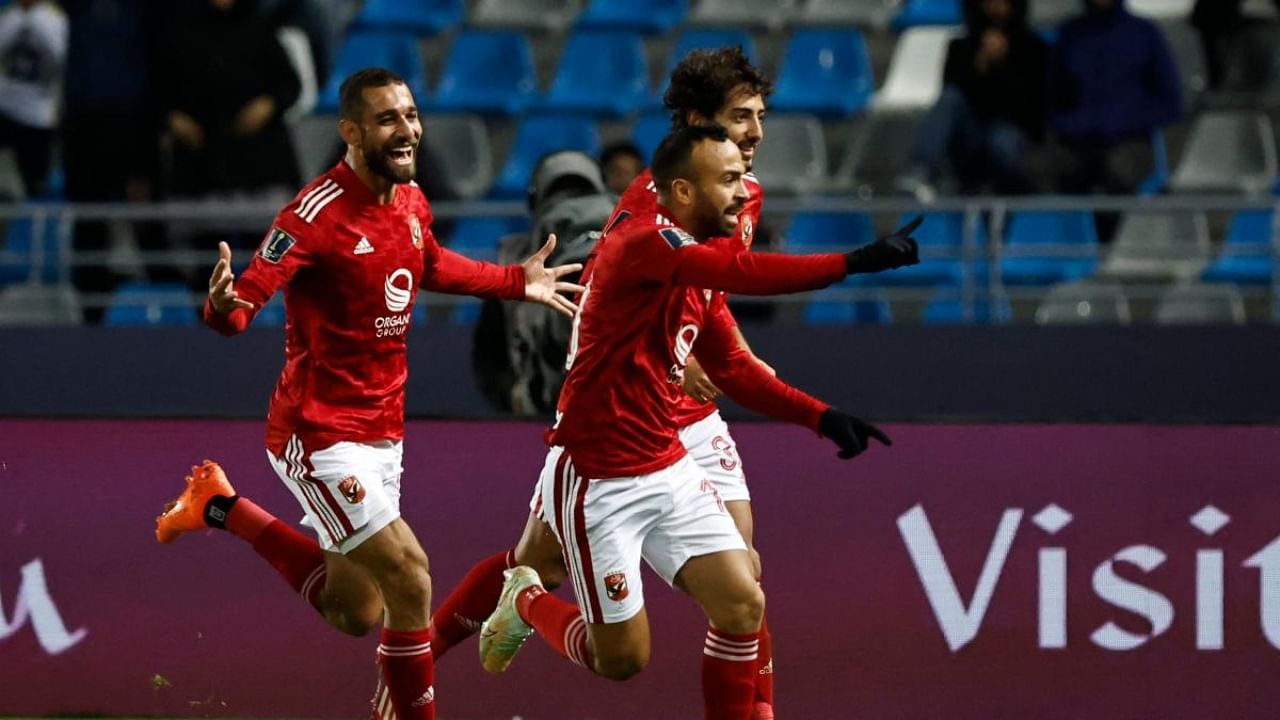 Ahly's Egyptian midfielder Mohamed Afsha (R) celebrates scoring his teams first goal during the FIFA Club World Cup second round football match between Seattle Sounders FC and Egypt's Al-Ahly. Credit: AFP Photo