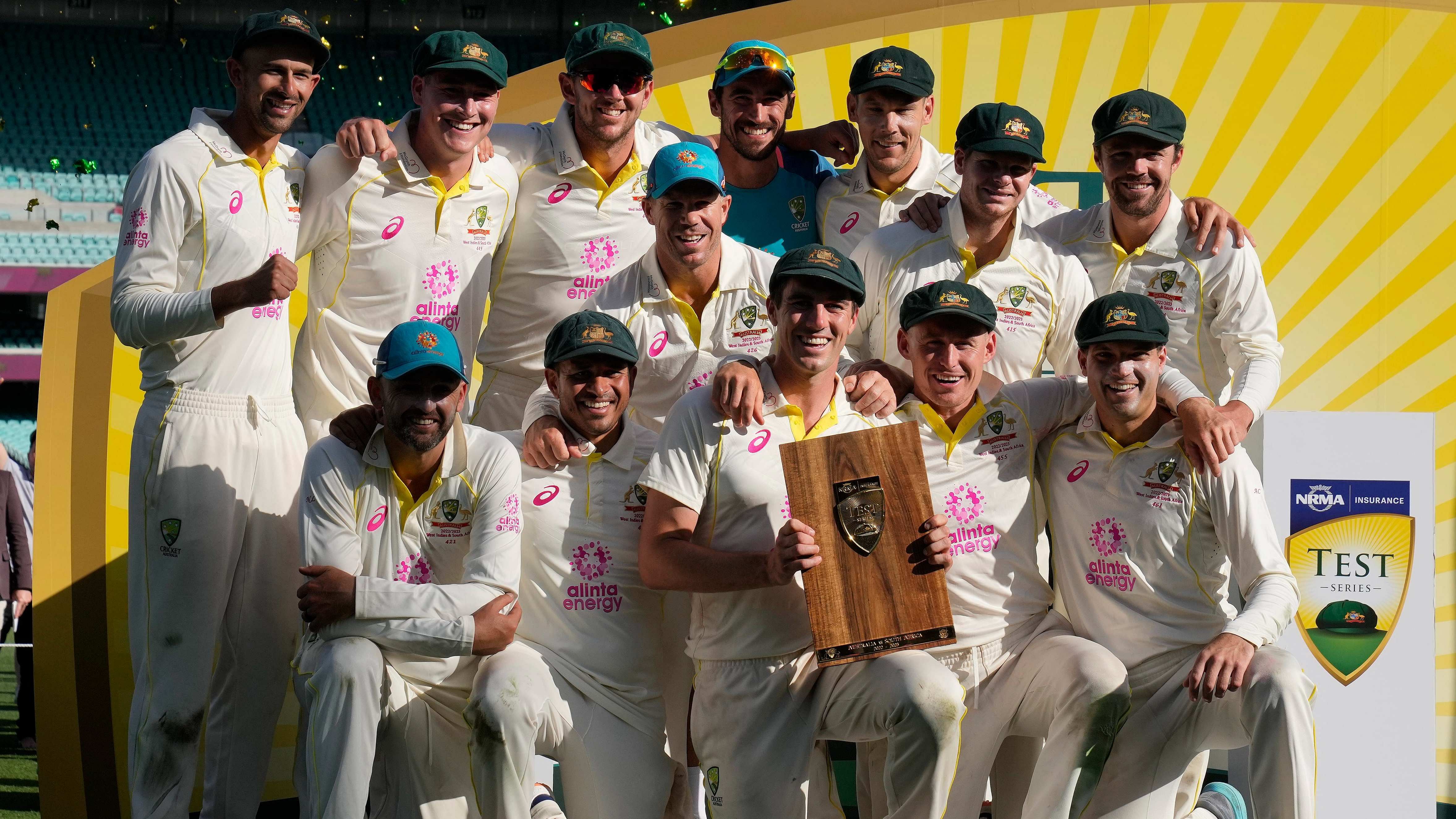 The Australian team poses with their trophy at the end of their cricket test match against South Africa at the Sydney Cricket Ground in Sydney, Sunday, Jan. 8, 2023. The match ended in a draw and Australia won the series 2-0. AP/PTI