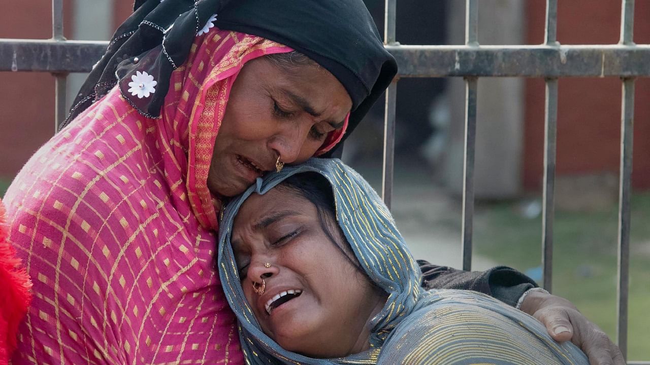 Relatives react after the arrest of people for their alleged involvement in child marriages, during the Assam government's statewide crackdown on child marriages, outside Mayong police station in Morigaon district, Saturday, Feb. 4, 2023. Credit: PTI Photo