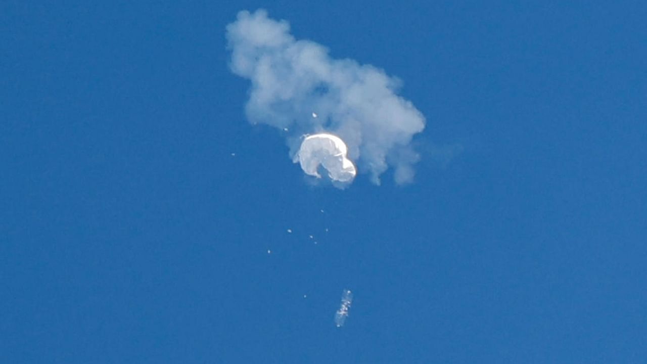 The suspected Chinese spy balloon drifts to the ocean after being shot down off the coast in Surfside Beach, South Carolina. Credit: Reuters Photo