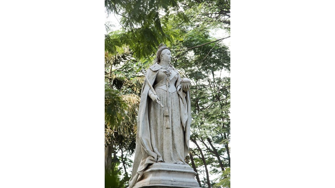 At 11 feet and carved in white marble by London-based sculptor Thomas Brock, Queen Victoria’s statue in Bengaluru is one of fifty such statues commissioned,  assembled and installed across the Indian subcontinent. Credit: Special Arrangement