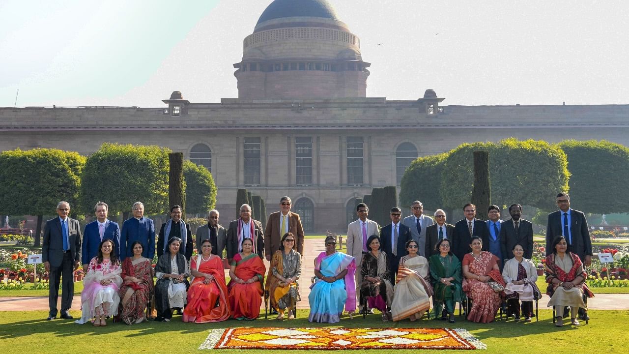President Droupadi Murmu with Chief Justice of India Justice D Y Chandrachud and judges of the Supreme Court during their visit to Amrit Udyan on the premises of Rashtrapati Bhavan, in New Delhi, Sunday, Feb. 5, 2023. Credit: PTI Photo