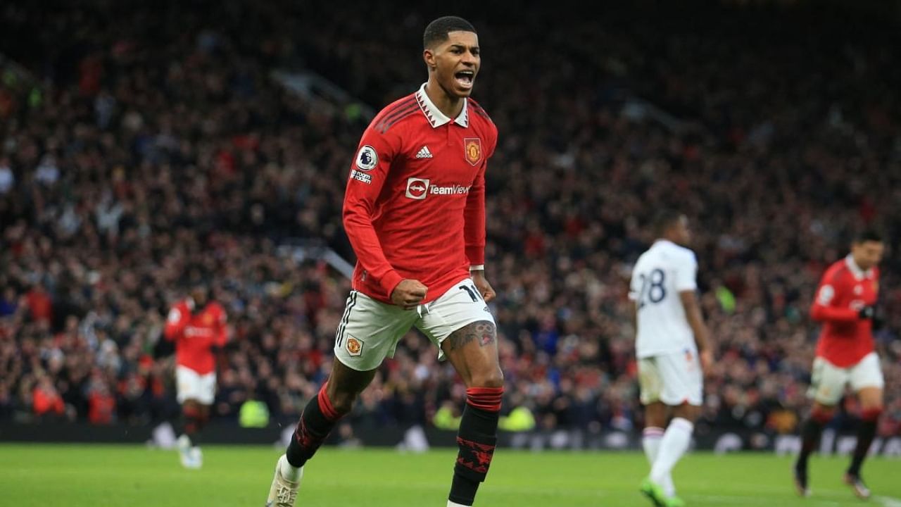 Manchester United's English striker Marcus Rashford celebrates after scoring his team's second goal. Credit: AFP Photo