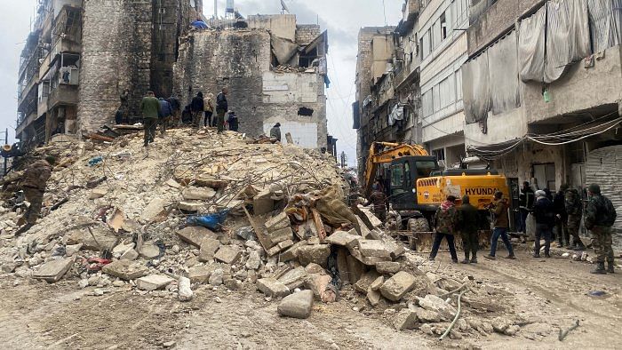 People search for survivors under the rubble, following an earthquake, in Aleppo, Syria February 6, 2023. Credit: Reuters Photo