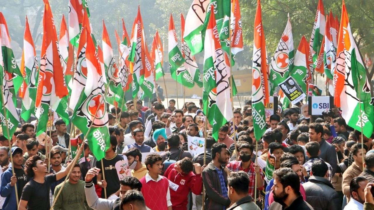 Indian Youth Congress members hold party flags staging a protest over Adani row, at Jantar Mantar in New Delhi on Monday, Feb. 06, 2023. Credit: IANS Photo