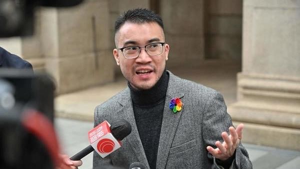 Transgender activist Henry Tse speaks to the media outside the Court of Final Appeal in Hong Kong on February 6. Credit: AFP Photo