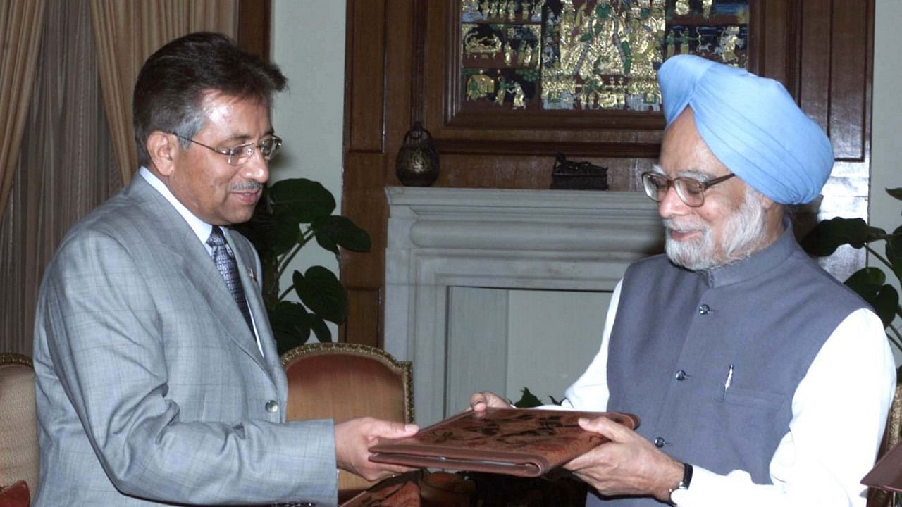Ex-Pakistan President General Parvez Musharraf is seen with ex-Indian Prime Minister Manmohan Singh in this file photo from April 17, 2005. Credit: PTI File Photo