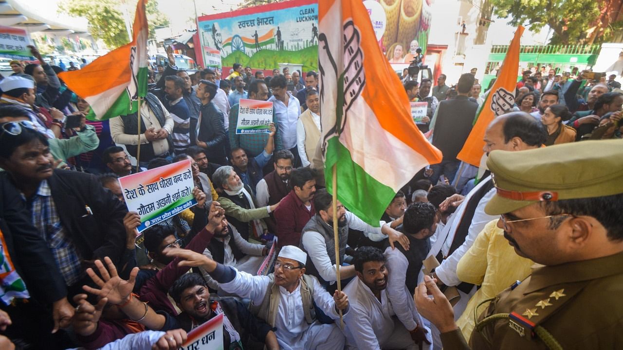 Congress workers stage a protest demanding inquiry into Adani row after Hindenburg report. Credit: PTI File Photo