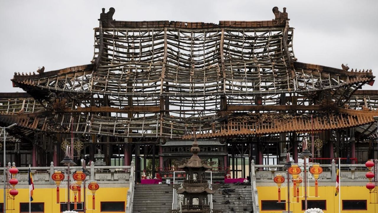 The damaged structure is seen at the scene of a fire at the Bright Moon Buddhist Temple in Springvale South, Melbourne. Credit: AP/PTI Photo