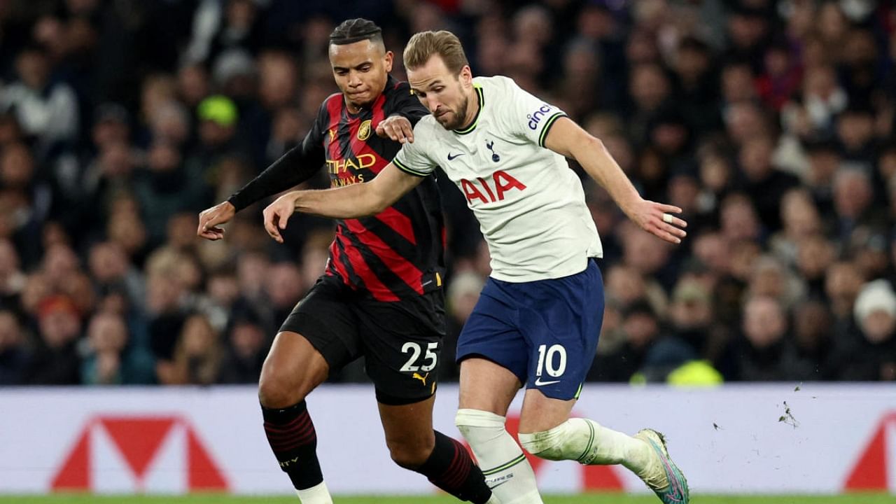 Manchester City's Manuel Akanji in action with Tottenham Hotspur's Harry Kane. Credit: Reuters Photo