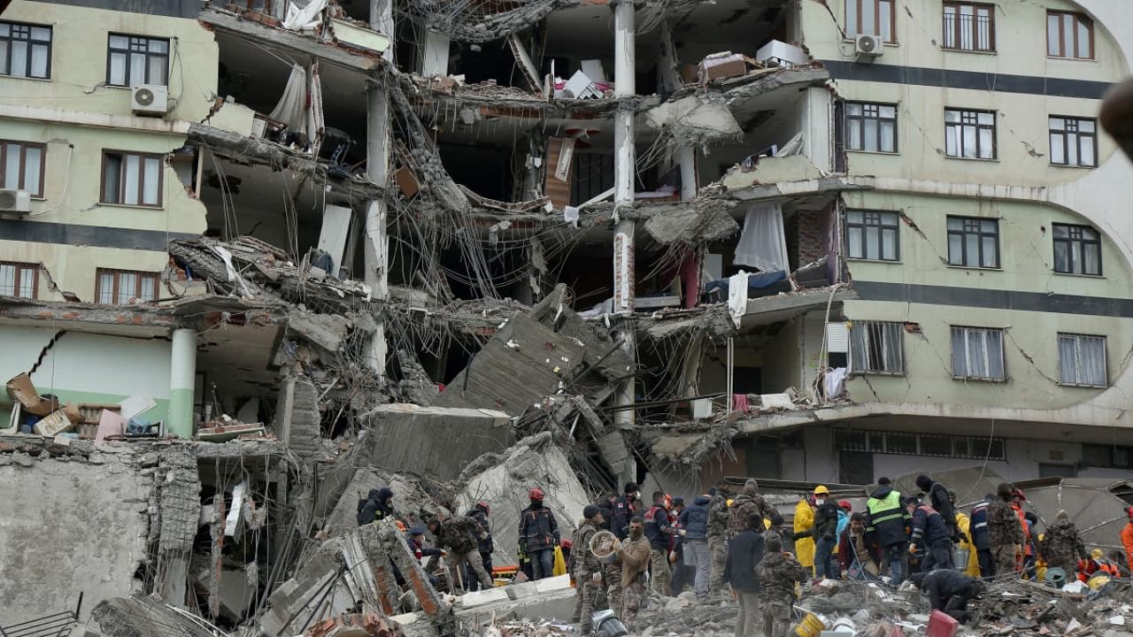 Rescue workers search for survivors under the rubble following an earthquake in Turkey. Credit: Reuters Photo