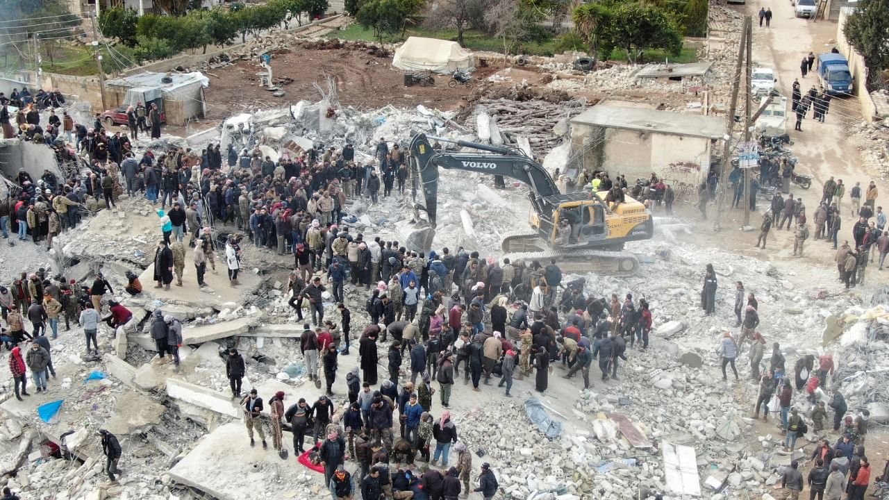 People gather as the search for survivors continues in the aftermath of an earthquake, in rebel-held town of Jandaris, Syria. Credit: Reuters Photo