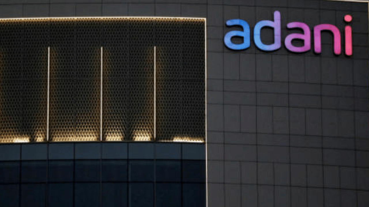 The logo of the Adani group is seen on the facade of one of its buildings on the outskirts of Ahmedabad, India, April 13, 2021. Credit: Reuters File Photo.