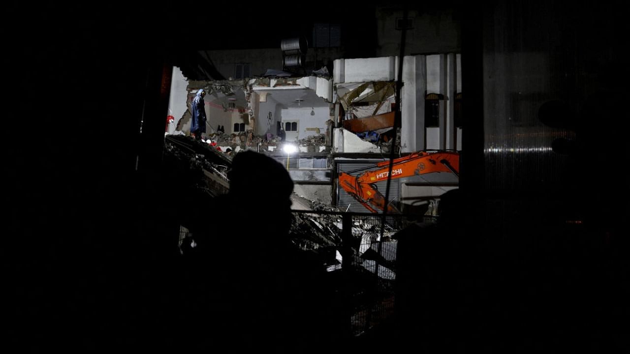 Rescuers search for survivors at the site of a collapsed building following an earthquake in Osmaniye, Turkey, February 6, 2023. Credit: Reuters Photo
