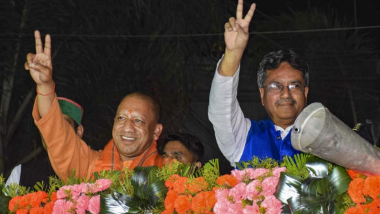 UP Chief Minster Yogi Adityanath with Tripura CM Manik Saha during an election campaign roadshow for upcoming Assembly elections. Credit: PTI Photo