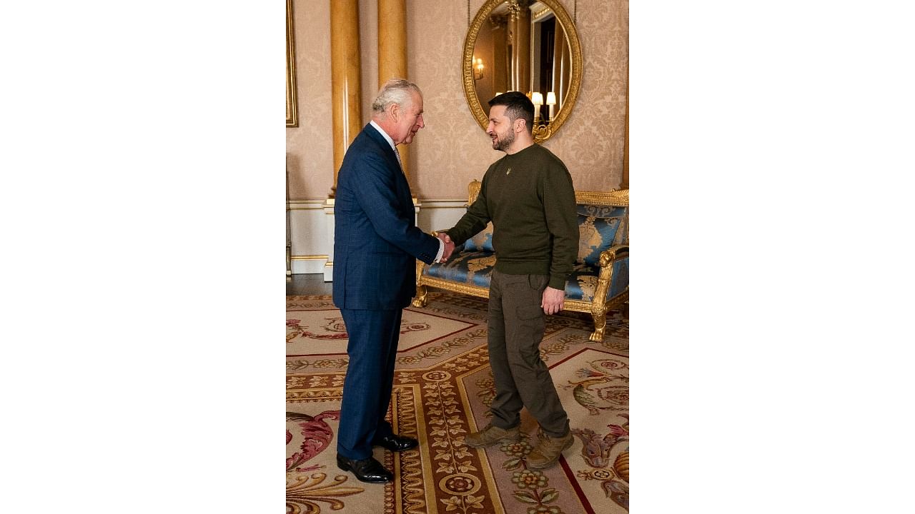 Yup, he didn’t abandon his sweatshirt, even for the king (who was in his usual Savile Row blue suit and tie). The image tells the story more than words can. Credit: AP Photo