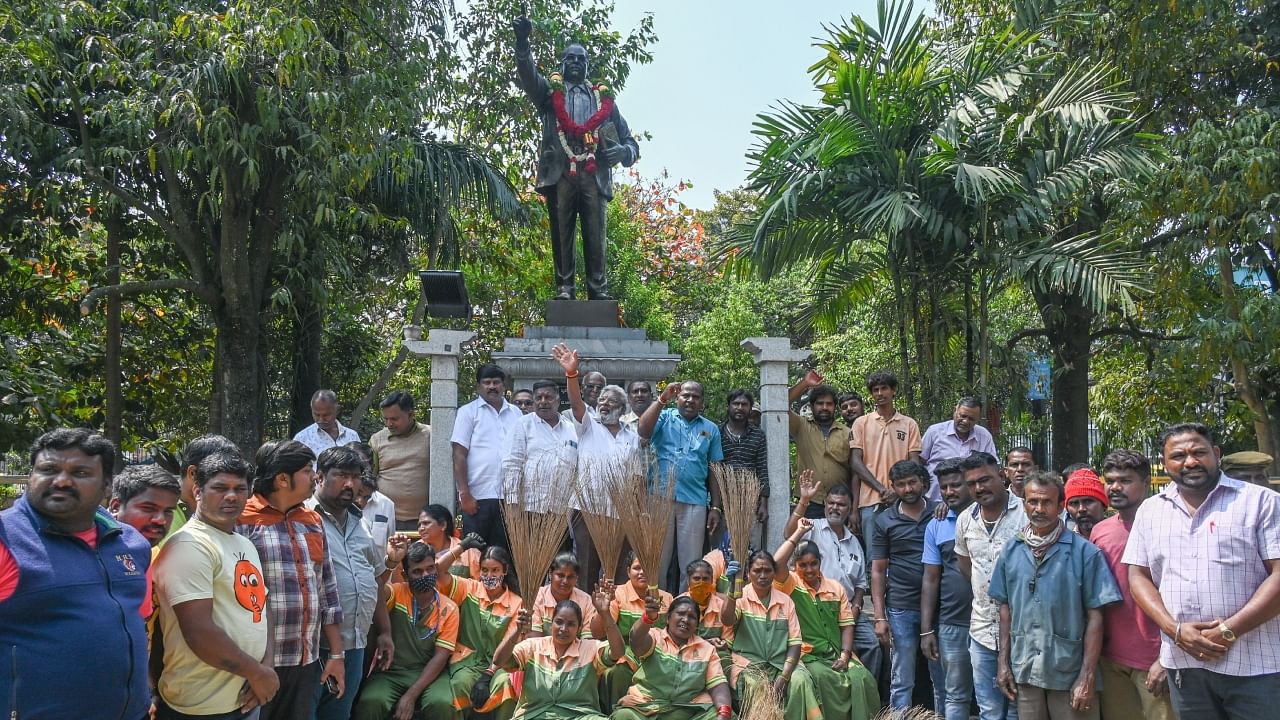 BBMP workers stage a protest in front of Ambedkar statue at BBMP Head Office in Bengaluru on Wednesday, February 8, 2023. Credit: DH Photo