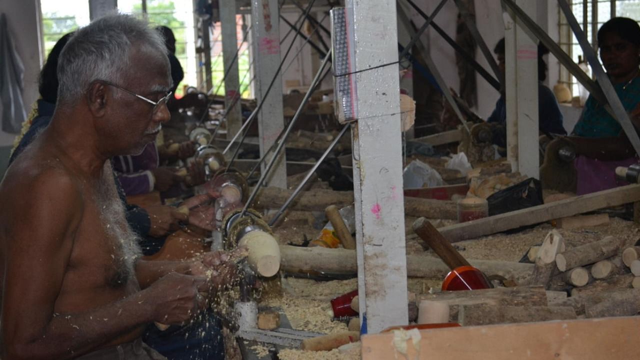 An artisan working on Channapatna toys. DH Photo