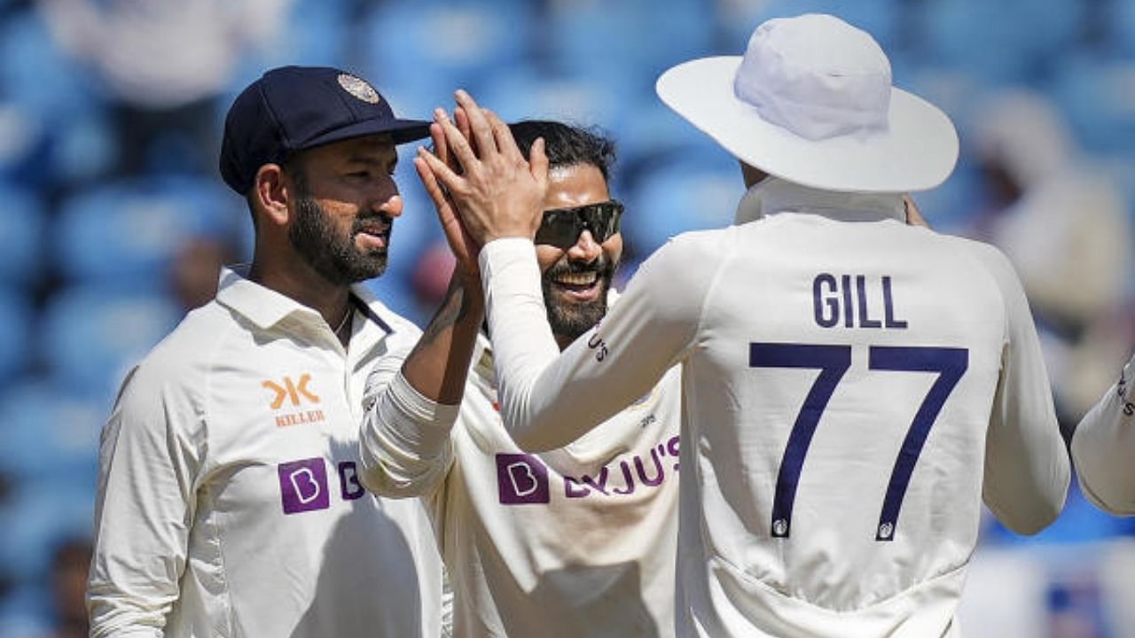 Ravindra Jadeja celebrates with teammates the wicket of Australian batter Steven Smith during the 1st test cricket match between India and Australia. Credit: PTI Photo