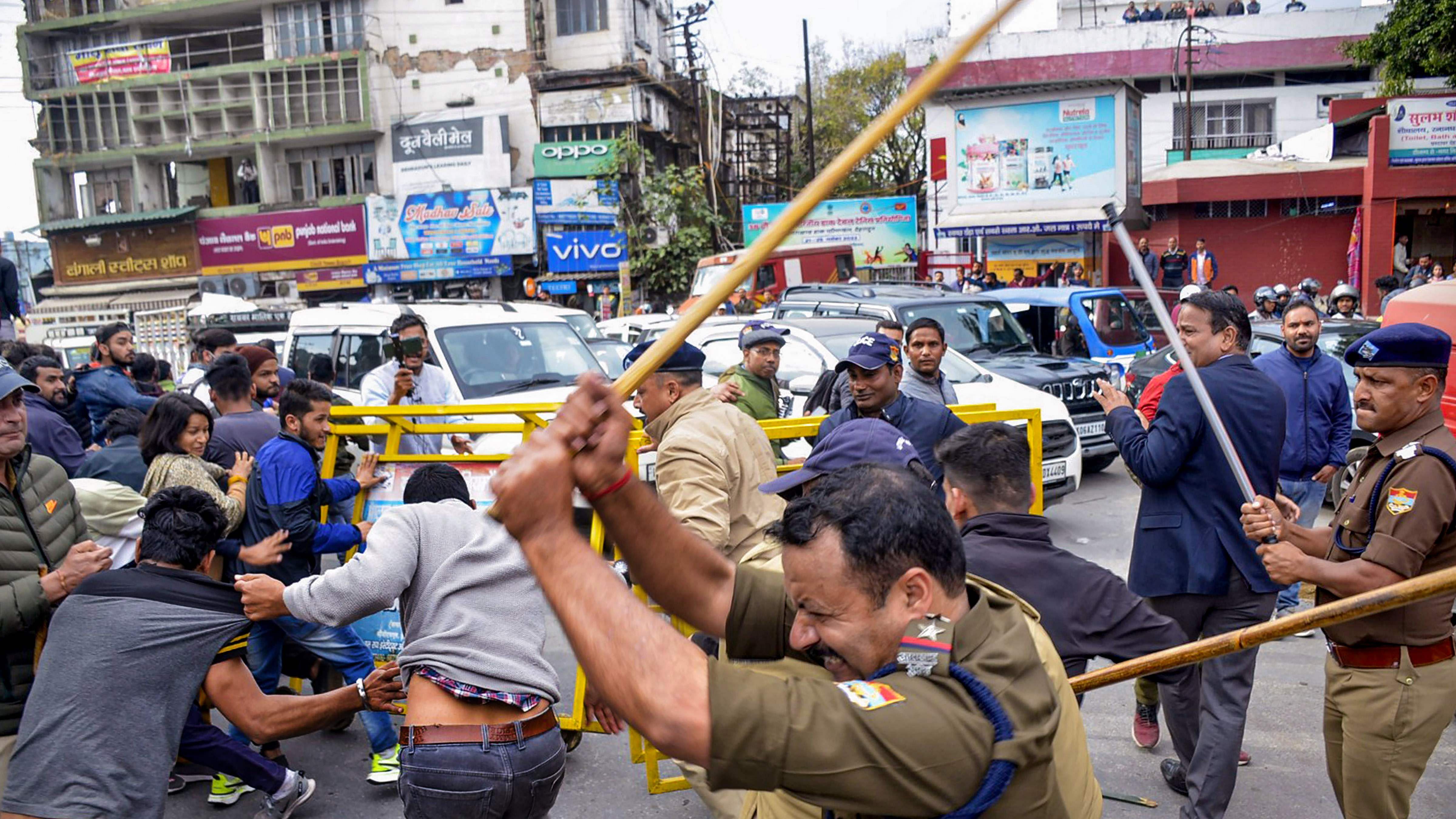 Police lathi-charge people protesting over alleged rigging. Credit: PTI Photo