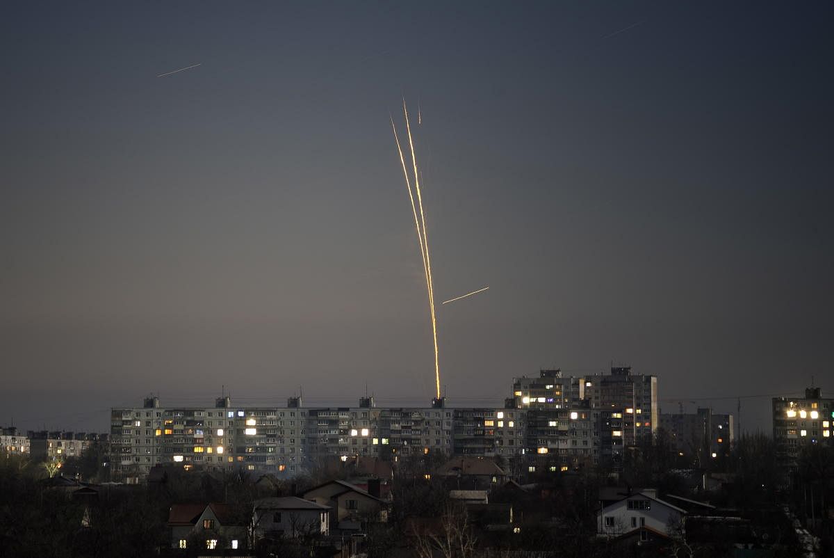 Russian rockets launched against Ukraine from Russia's Belgorod region are seen at dawn in Kharkiv, Ukraine. Credit: AP/PTI Photo