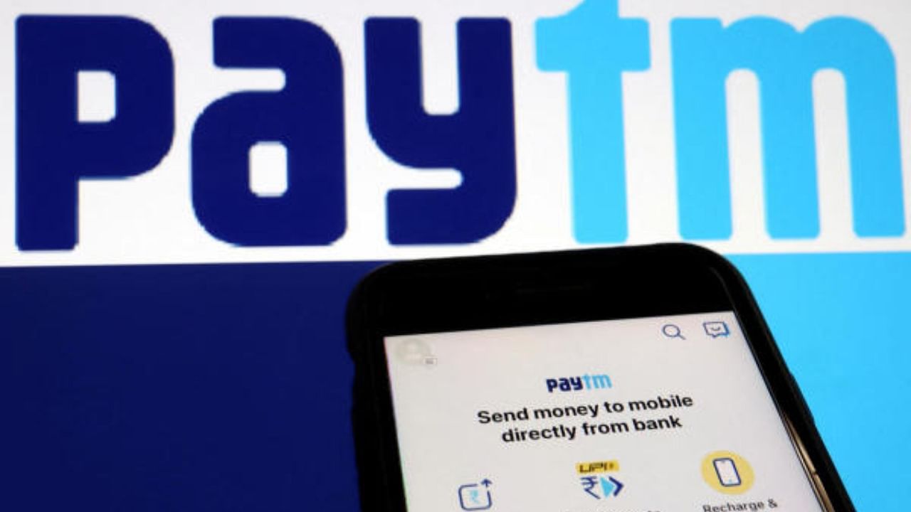 The interface of Indian payments app Paytm is seen in front of its logo. Credit: Reuters File Photo