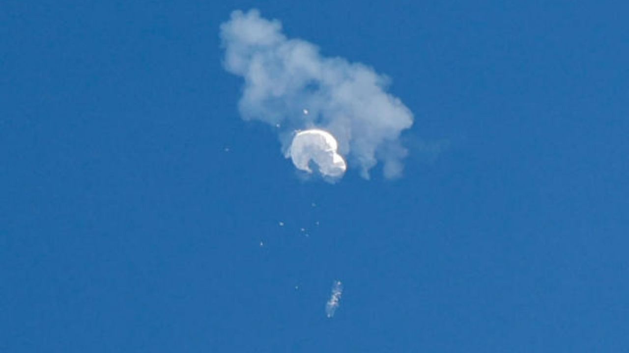 The suspected Chinese spy balloon drifts to the ocean after being shot down by the US Airforce, off the coast of Surfside Beach, South Carolina. Credit: Reuters Photo