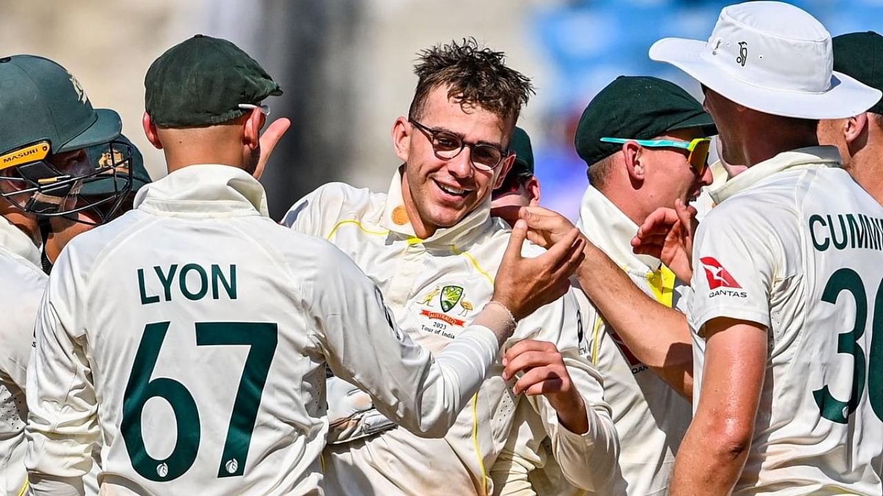 Australia's players celebrates with teammate Todd Murphy (C) after his fifth wicket of India's Srikar Bharat (not pictured) during the second day of the first Test cricket match between India and Australia at the Vidarbha Cricket Association (VCA) Stadium in Nagpur on February 10, 2023. Credit: AFP Photo