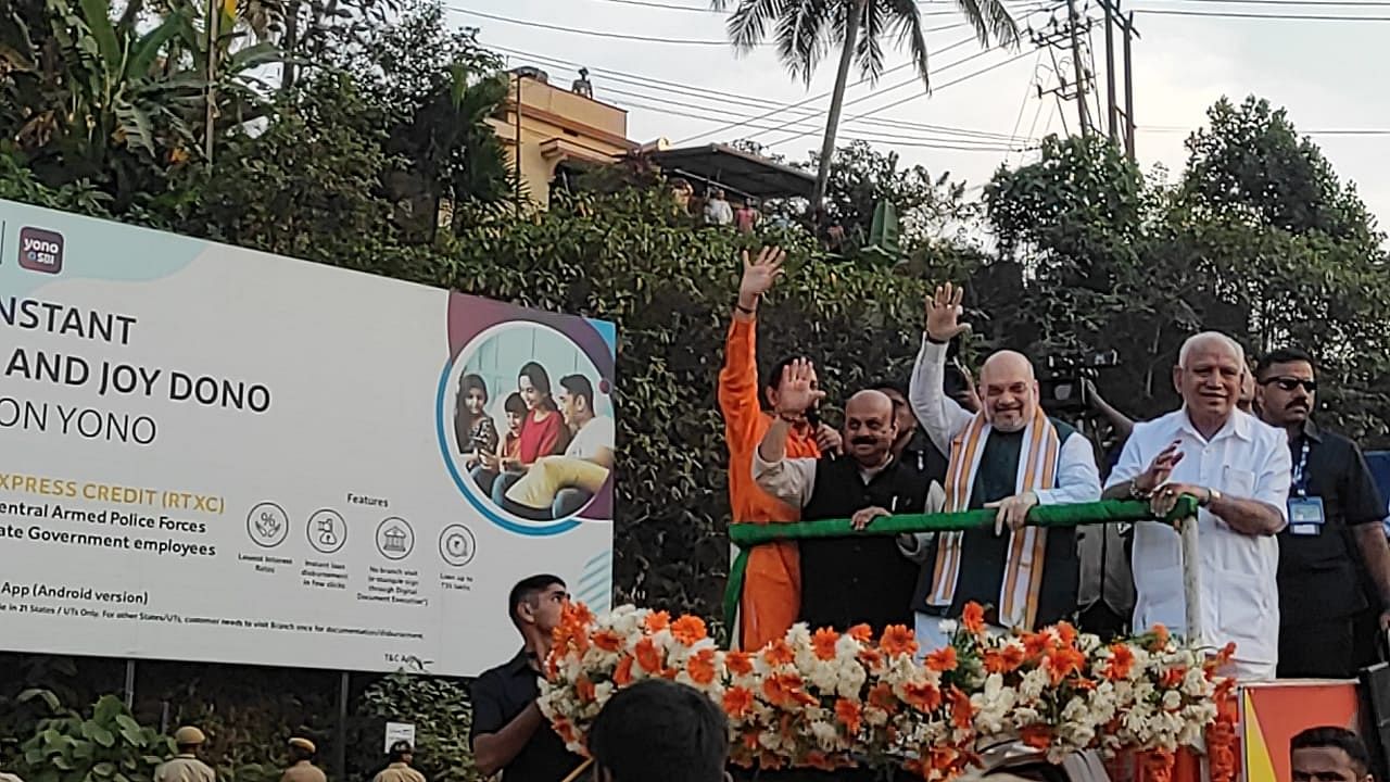 Union Minister of Home Affairs and Cooperation Amit Shahalong with CM Basavaraj Bommai, former CM B S Yediyurappa wave at the party workers. Credit: Special Arrangements 