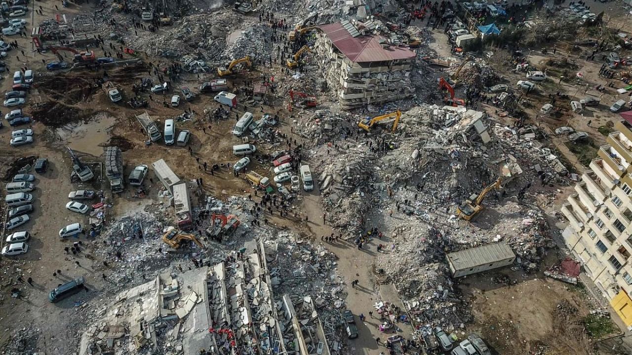This aerial view shows collapsed buildings during the ongoing rescue operation in Kahramanmaras, the epicentre of the first 7.8-magnitude tremor five days ago, in southeastern Turkey, on February 10, 2023. Credit: AFP Photo