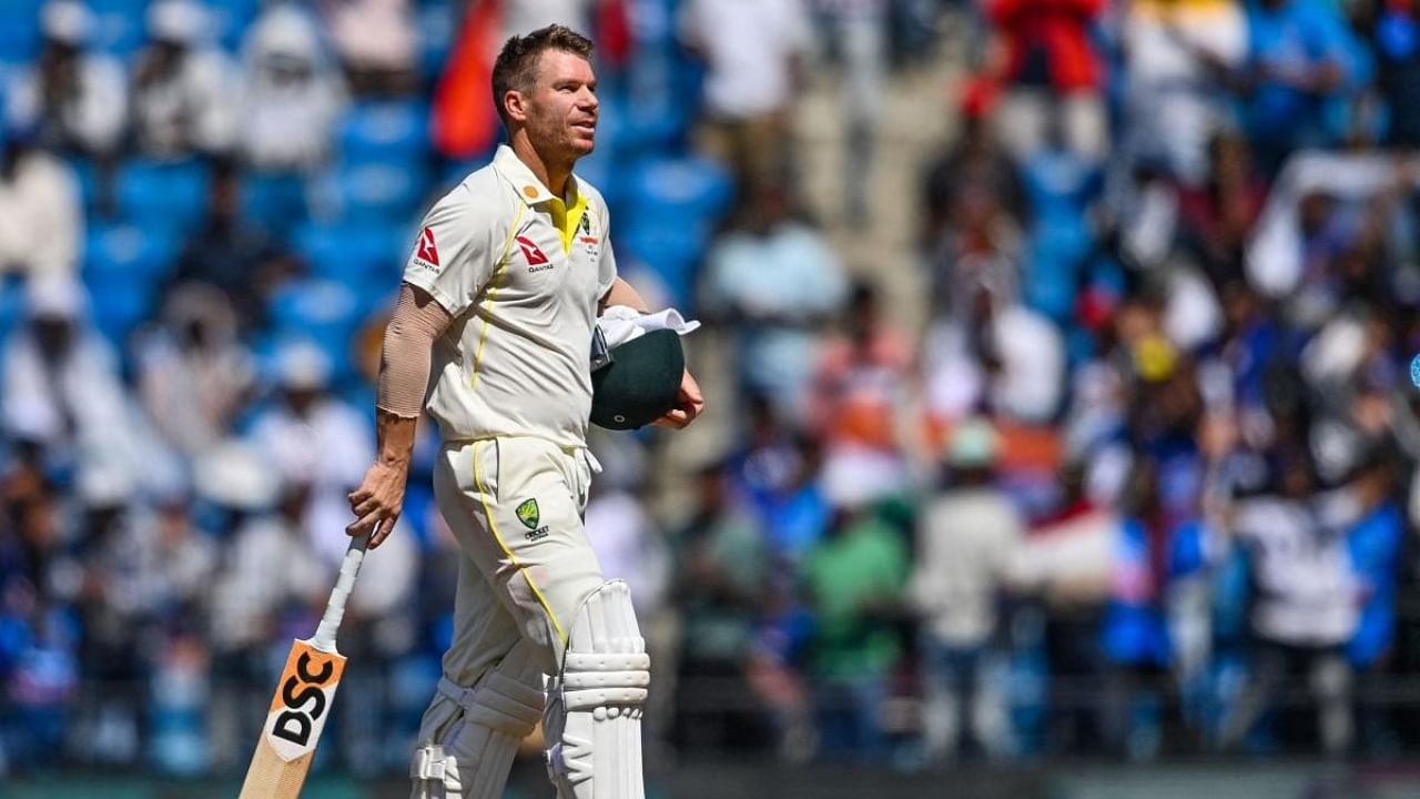 Australia's David Warner walks back to the pavilion after his dismissal during the third day of the first Test cricket match. Credit: AFP Photo