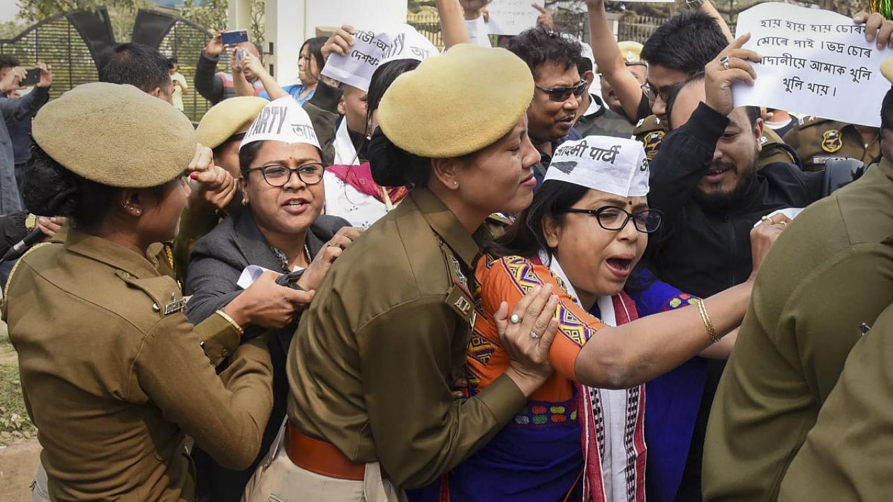 Police detain AAP workers during a protest over Adani row. Credit: PTI Photo