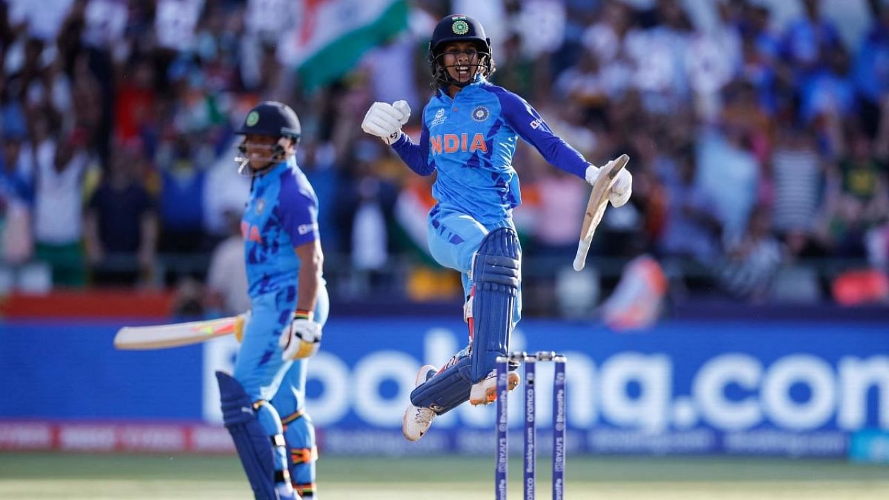 Jemimah Rodrigues (R) celebrates after scoring a half-century (50 runs) during the Group B T20 women's World Cup cricket match between India and Pakistan at Newlands Stadium in Cape Town. Credit: AFP Photo