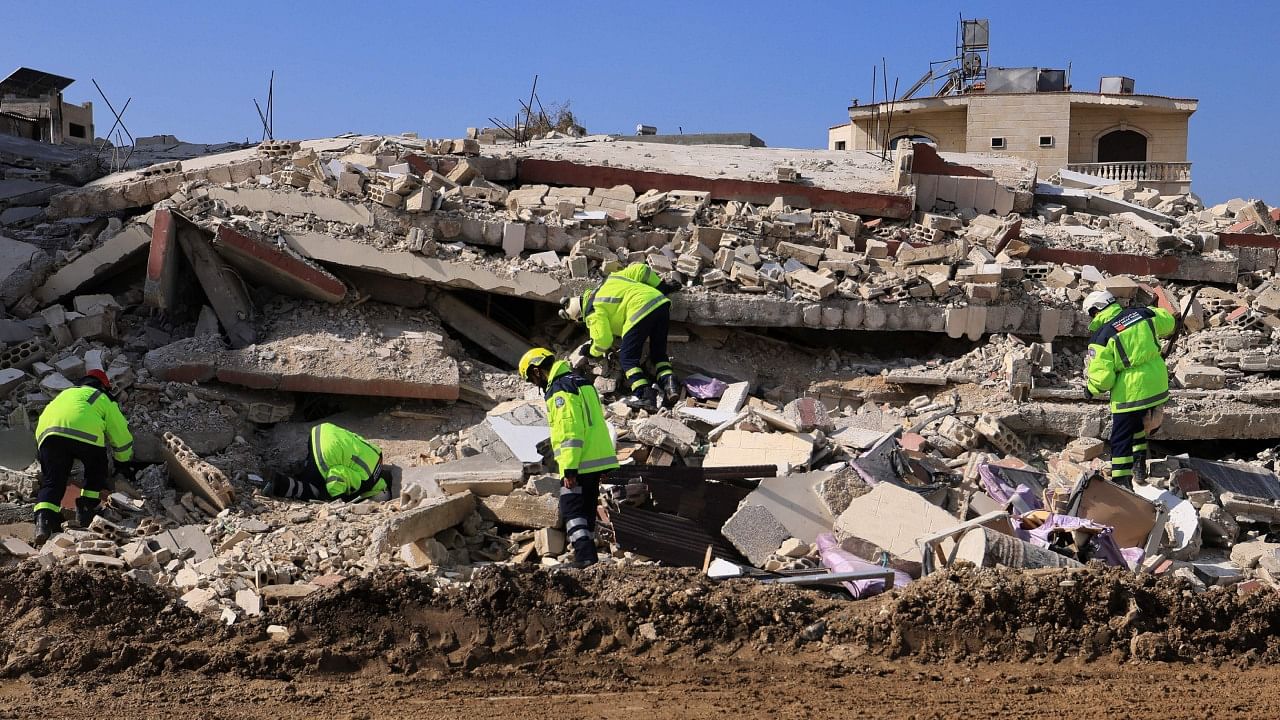 Emirati rescuers continue their search and rescue operations in the regime-controlled town of Jableh in the province of Latakia, northwest of the Syrian capital, on February 12 2023. Credit: AFP Photo