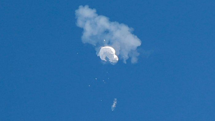 The suspected Chinese spy balloon drifts to the ocean after being shot down off the coast in Surfside Beach, South Carolina. Credit: Reuters Photo