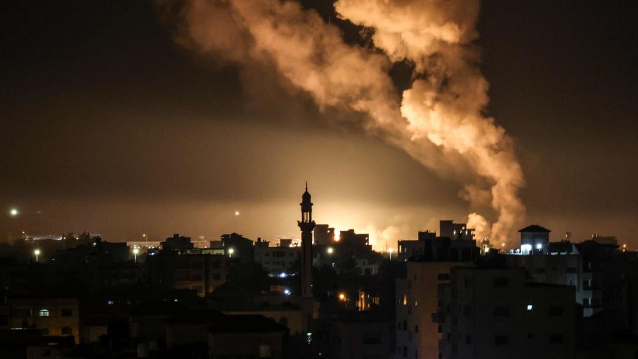 Fire and smoke rise above buildings in Gaza City as Israel launched air strikes on the Palestinian enclave. Credit: AFP Photo